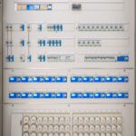 Detailed view of a modern electrical panel featuring circuit breakers and sockets for efficient energy distribution.